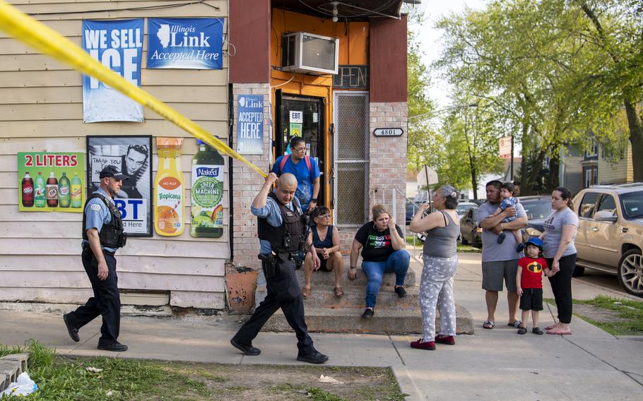 Chicago police work the scene of a fatal shooting in the Back of the Yards neighborhood, in Chicago, Tuesday, May 10, 2022.