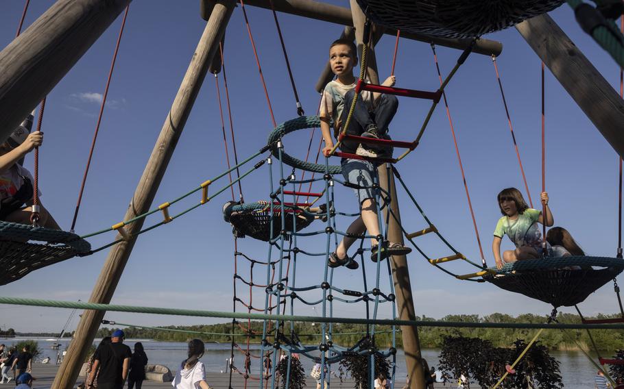 Children play at a riverside park in Dnipro last week. 
