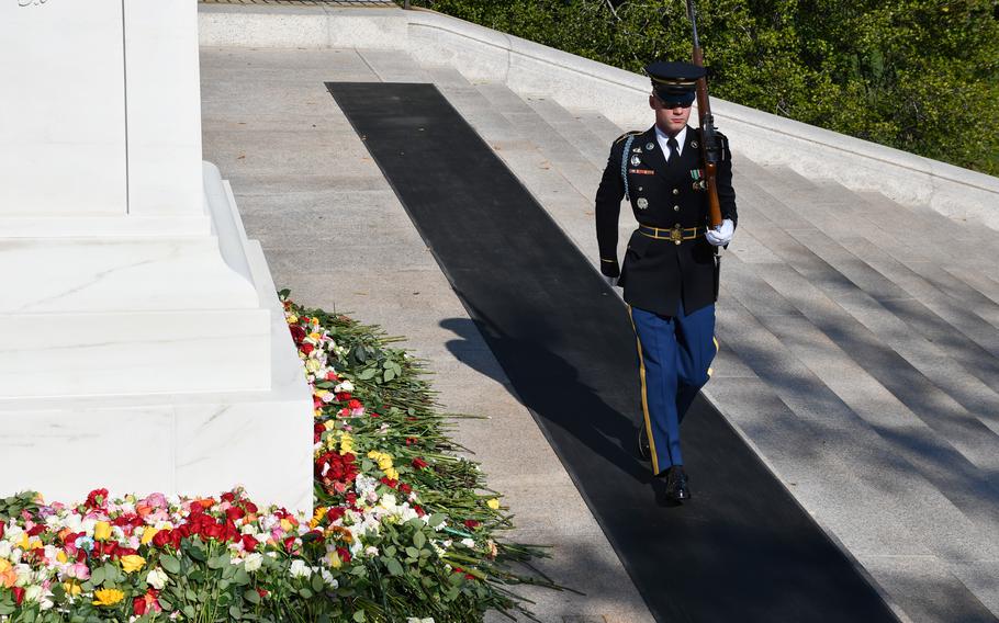 A guard of the Tomb of the Unknown Soldier marches at the back of the tomb on Wednesday, Nov. 10, 2021. While they typically guard the front of the tomb, the sentinels were moved to the back during a two-day ceremony that allowed members of the public to place flowers at the tomb’s base. 