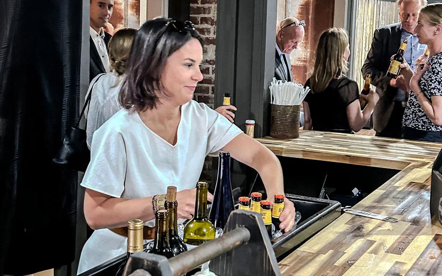 Germany’s Foreign Minister Annalena Baerbock got behind the bar and served beers during a visit to Back Porch BBQ and Grill In La Grange, Texas.