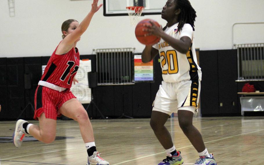 Kadena's Kayla Johnson tries to shoot as Kinnick's Sydney Walker hustles over to defend. The Red Devils won 26-9.