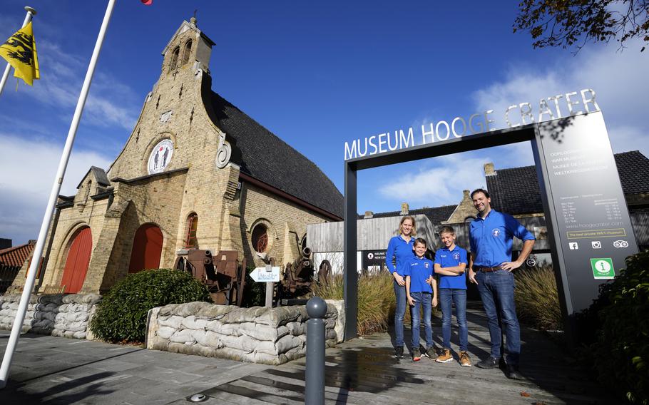 Nick Benoot poses with his family outside the Hooge Crater Museum in Ypres, Belgium, Thursday, Nov. 4, 2021. 