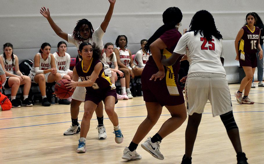 Vilseck junior Jayslin Santellano picks up the ball after getting past Kaiserslautern junior Vernesha Oliver during pool-play action of the DODEA European basketball championships on Feb.14, 2024, at the Wiesbaden Sports and Fitness Center on Clay Kaserne in Wiesbaden, Germany.