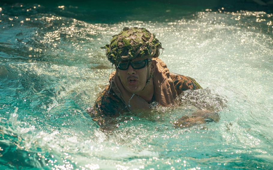  Lance Cpl. Angel Morales-Gregorio, of Arizona, a mortarman with Alpha Company, Battalion Landing Team 1/5, 15th Marine Expeditionary Unit, swims during an Amphibious Combat Vehicle egress drill at White Beach Naval Facility, Okinawa, Japan, June 24, 2024.