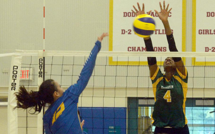 Robert D. Edgren's Elizabeth Johnson goes up to block a shot by Yokota's Elena Haas during Friday's girls volleyball match. The Eagles won in straight sets.