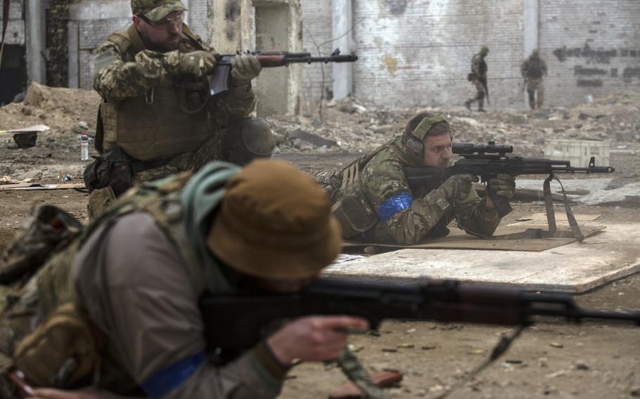 Ukrainian members of the Azov Battalion practice shooting live bullets at a training site in Kyiv, Ukraine, on March 24, 2022.