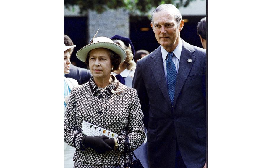 James E. Bassett III is photographed with Queen Elizabeth II during her visit to Keeneland race track in Lexington, Ky., Oct. 11, 1984.