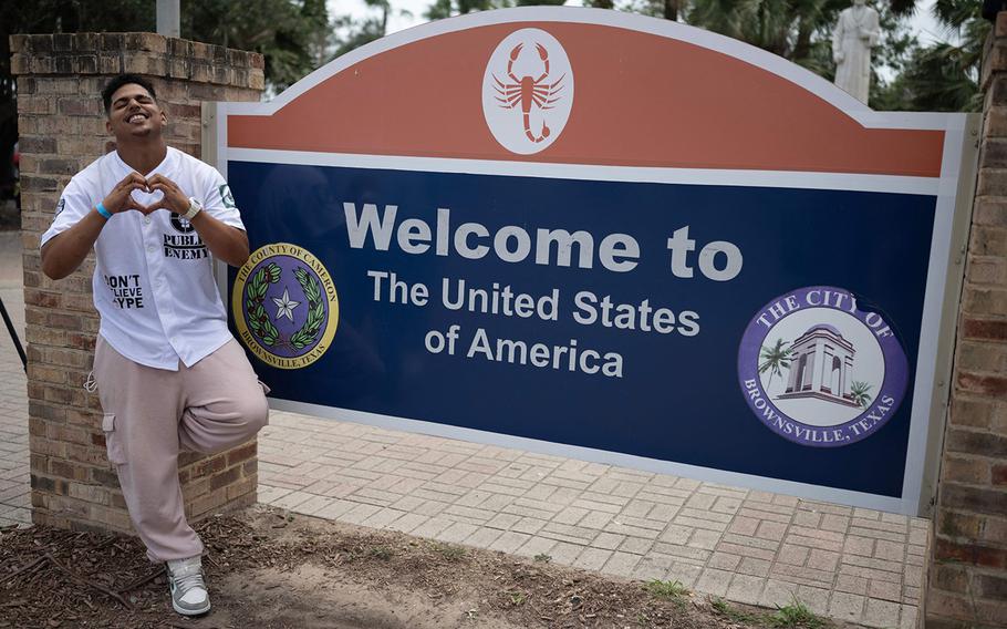 Neiker Medina from Venezuela poses for a photo as he celebrates his arrival into the United States after obtaining an appointment to legally enter the country from Mexico on May 12, 2023, in Brownsville, Texas. 