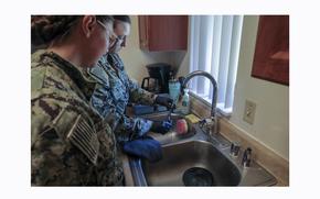 Members of the Navy’s Rapid Response Team test tap water at an Aliamanu Military Reservation home in Honolulu on March 21, 2024. 