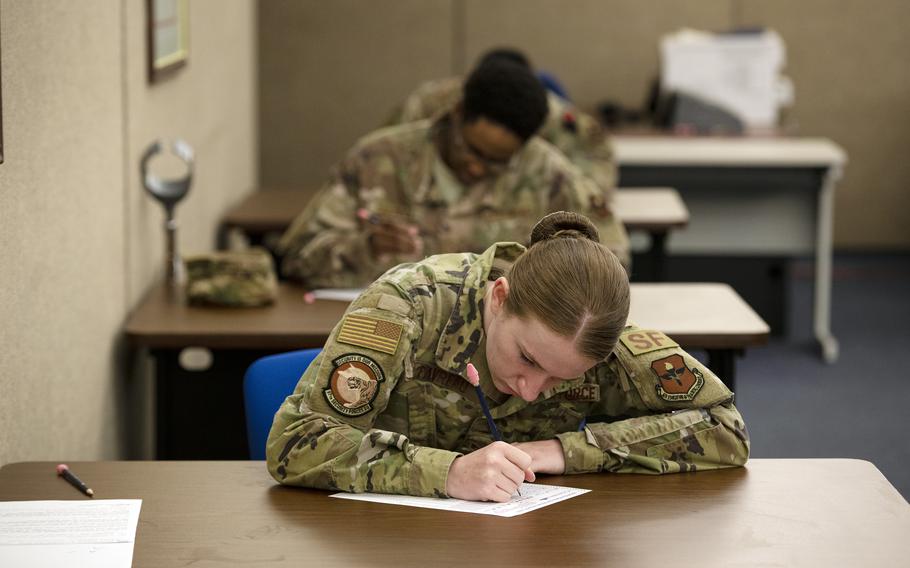 A senior airman fills out a promotion testing form at Altus Air Force Base, Okla., May 20, 2020.