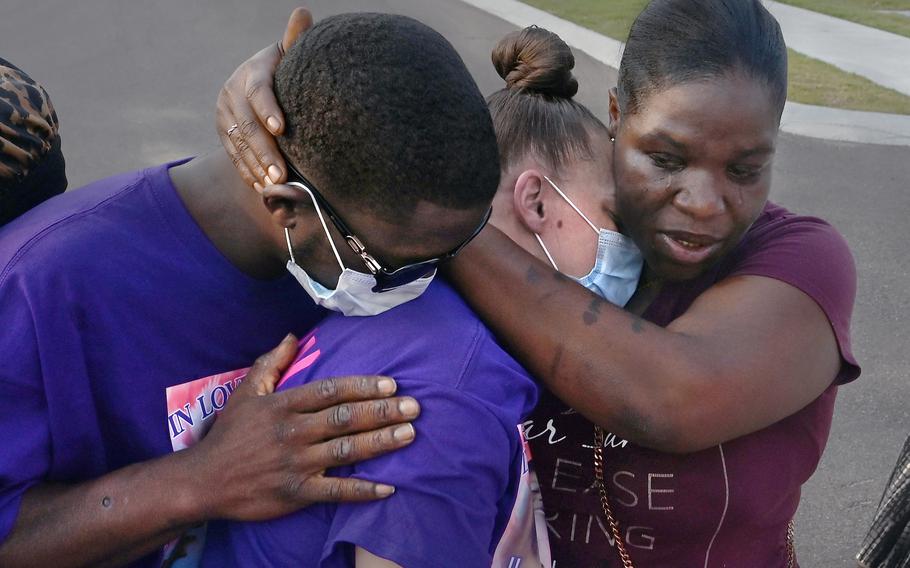 Ricky Franklin and his wife, Caylenn Franklin, center, are comforted by Anglea Jackson on Aug. 6 in West Memphis, Ark. The Franklins’ 11-year-old daughter, Jordyn, died of COVID.