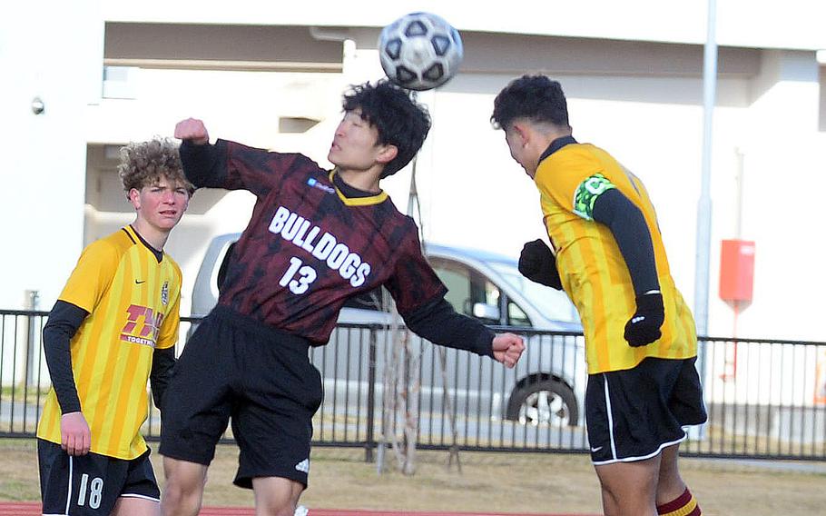 Marist's Jay Muto and Perry's Ren Spinosi go up to head the ball.