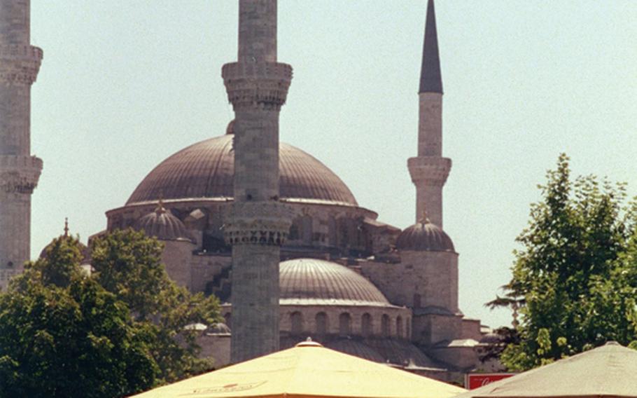 Istanbul's Blue Mosque provides a dramatic backdrop for a pleasant cafe.