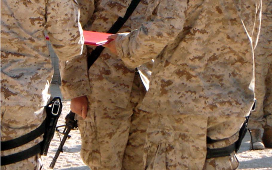 Marine Cpl. Javier Alvarez, center, earned the Silver Star for actions in Iraq on Nov. 16, 2005.