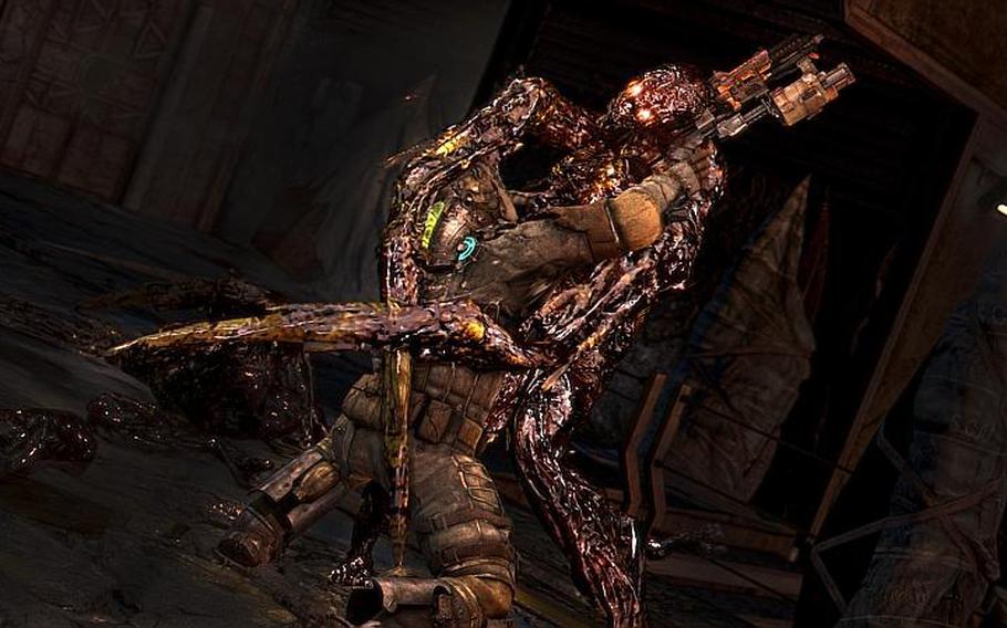 A necromorph finishes off a character in ‘Dead Space 3.’