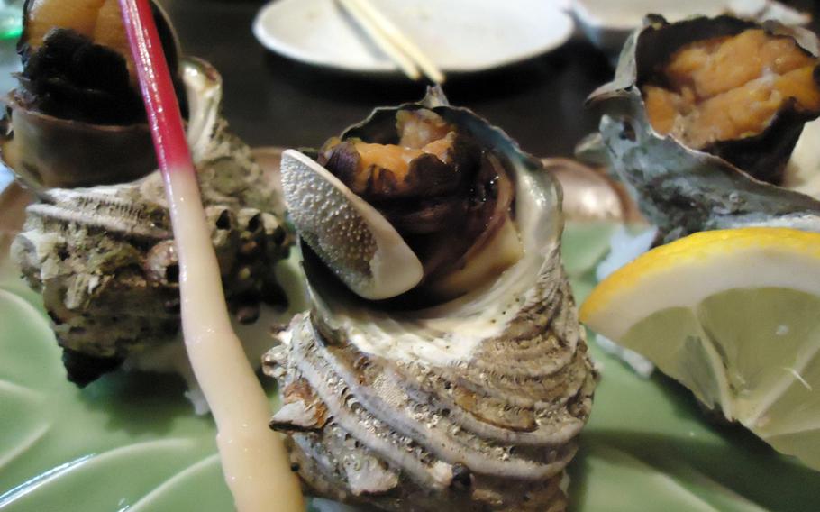  Customers at Sasebo's Juan can enjoy fresh shellfish, grilled and placed on a bed of salt with a fresh ginger root garnish.