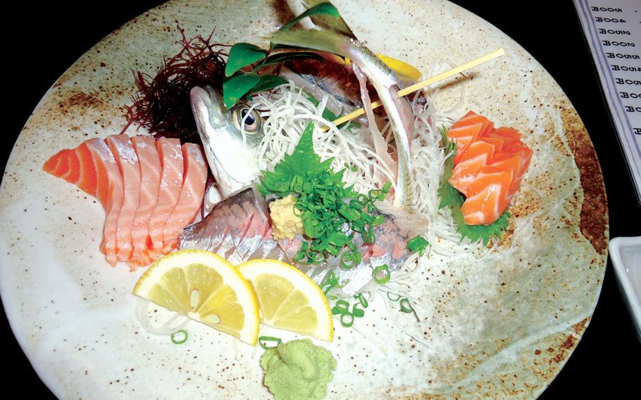 At Juan restaurant in Sasebo, Japan, cuisine is art. Here we see a plate of salmon sashimi and a hand-picked Japanese mackerel, straight from the ocean to the tank, and then to the dinner table. The mackerel -- called aji -- was removed from the tank and cut to perfection. Sometimes, the tail still moves a bit after it is served. 