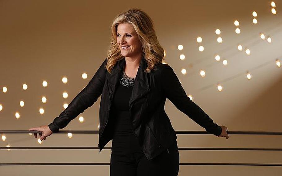 Trisha Yearwood  announced Tuesday, Aug. 19, she's releasing new music _ a hits package with six new songs called "PrizeFighter." She is also launching cookware and cutlery lines, begins a new season of "Trisha's Southern Kitchen" next week and has her third cookbook out next spring. (AP Photo/Mark Humphrey)