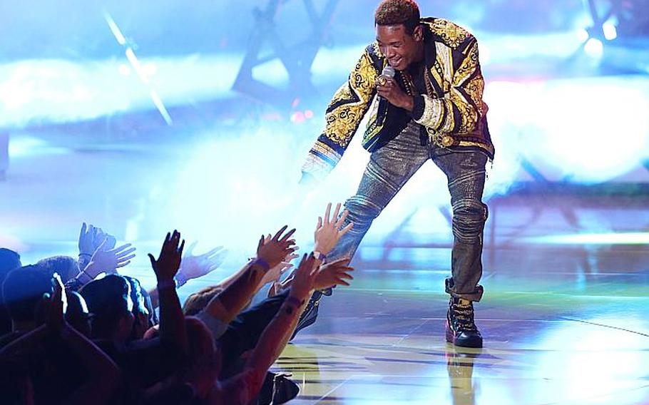 FILE - In this April 12, 2015, file photo, Fetty Wap performs at the MTV Movie Awards at the Nokia Theatre in Los Angeles. Wap has had an unprecedented amount of success without the release of an album: The rapper-singer is enjoying another week with two songs in the Top 10 on the Billboard Hot 100 chart (a third track sits in the Top 20), heâ€™s on tour with Chris Brown and he even surprised Taylor Swiftâ€™s audience at one of her recent shows with his ubiquitous hit, â€œTrap Queen.â€� After much anticipation, Wap is finally ready to release his debut album on Sept. 25, 2015, just days before the deadline for Grammy eligibility.   (Photo by Matt Sayles/Invision/AP, File)