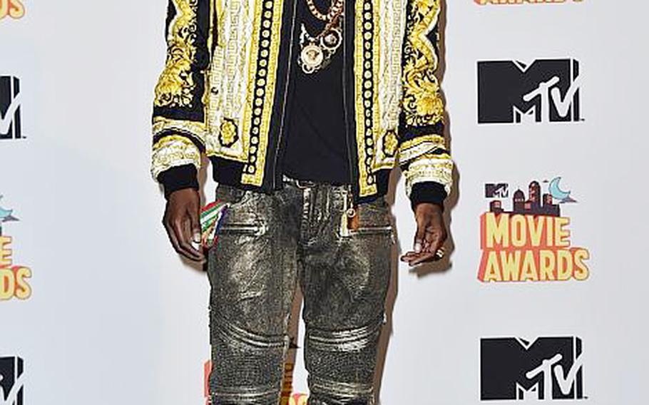 FILE - In this April 12, 2015, file photo, Fetty Wap poses in the press room at the MTV Movie Awards at the Nokia Theatre in Los Angeles. Wap has had an unprecedented amount of success without the release of an album: The rapper-singer is enjoying another week with two songs in the Top 10 on the Billboard Hot 100 chart. After much anticipation, Wap is finally ready to release his debut album on Sept. 25, 2015, just days before the deadline for Grammy eligibility.  