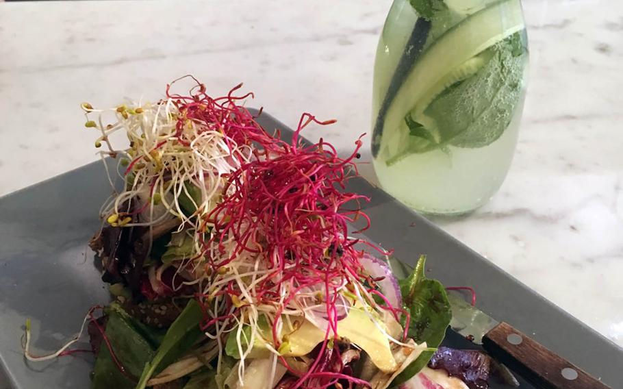 Avocado toast, topped with radish and bean sprouts in on the menu at  Claus Eismanufaktur & Deli, a trendy eatery in downtown Stuttgart.