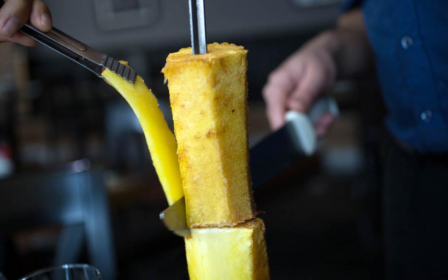 Grilled pineapple sliced at the Rio Grill in Songtan, South Korea.