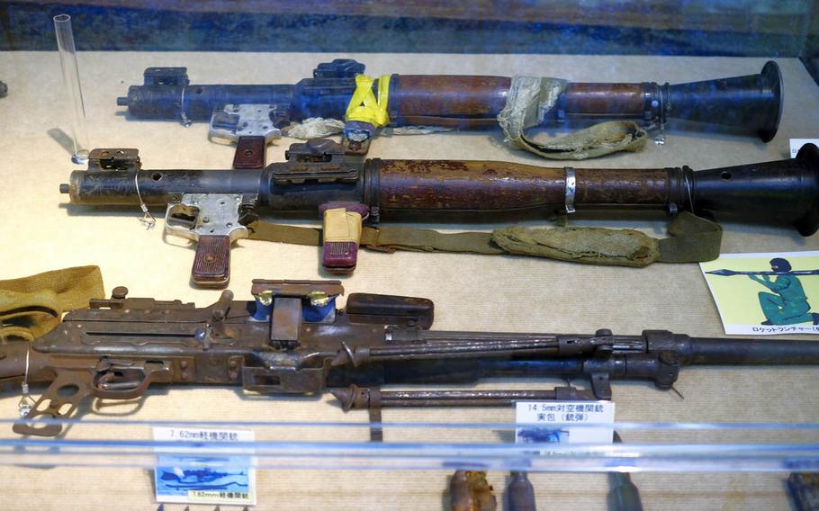 Weapons recovered from a North Korean spy vessel on display at the Japan Coast Guard Museum in Yokohama include automatic machine guns and rocket-propelled grenades. 