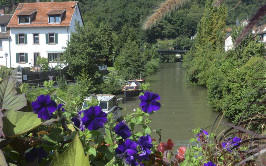 A bridge over the tranquil Elsanz River is lined with flowers in the picturesque town of Neckargemuend, just outside Heidelberg.

