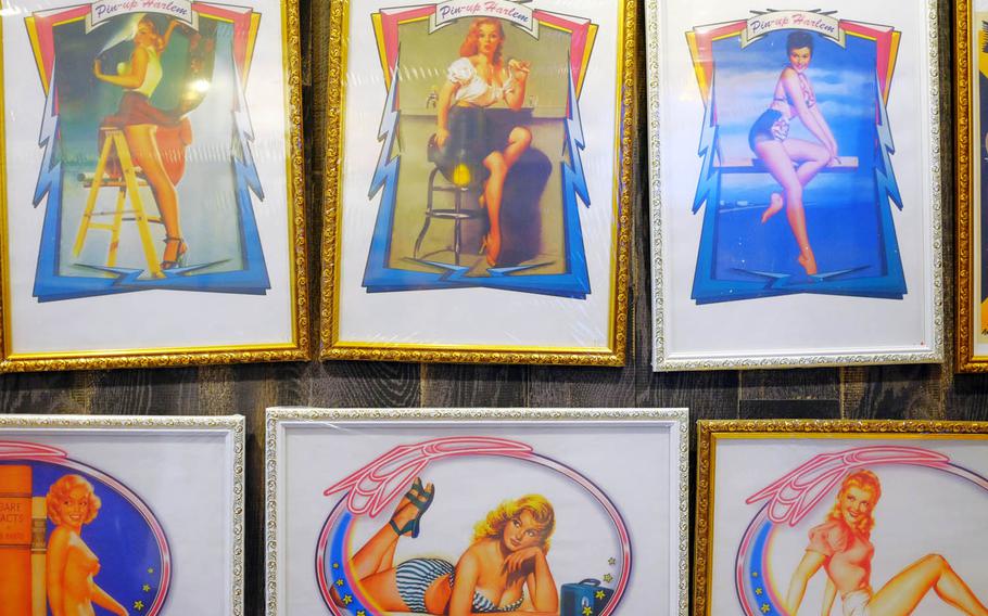 Framed pictures of pin-up models cover the walls at Doo Wop Diner in Yokosuka, Japan. 