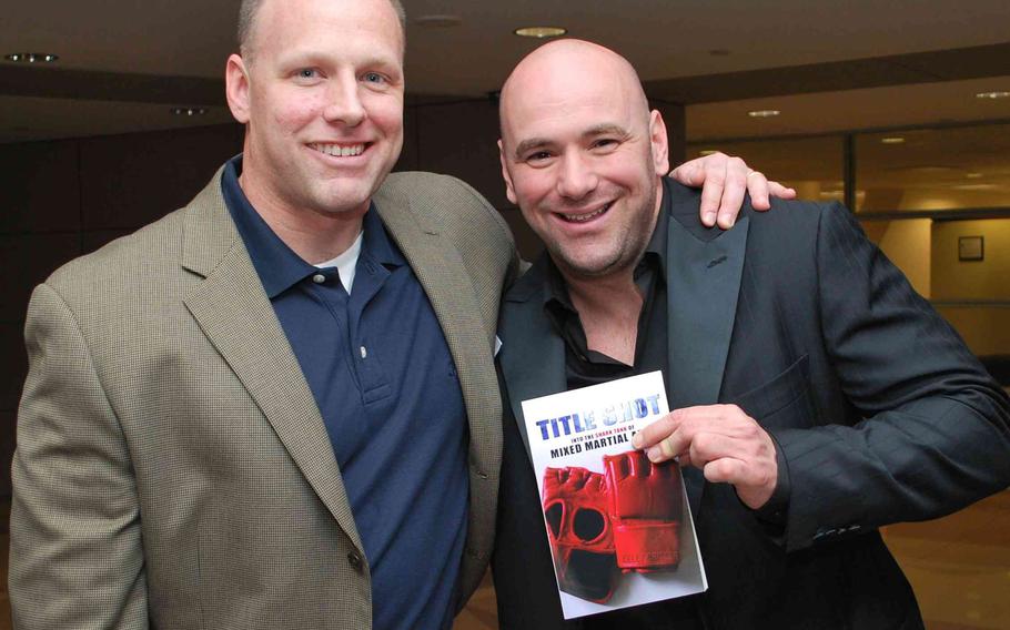Kelly Crigger stands with UFC President Dana White.