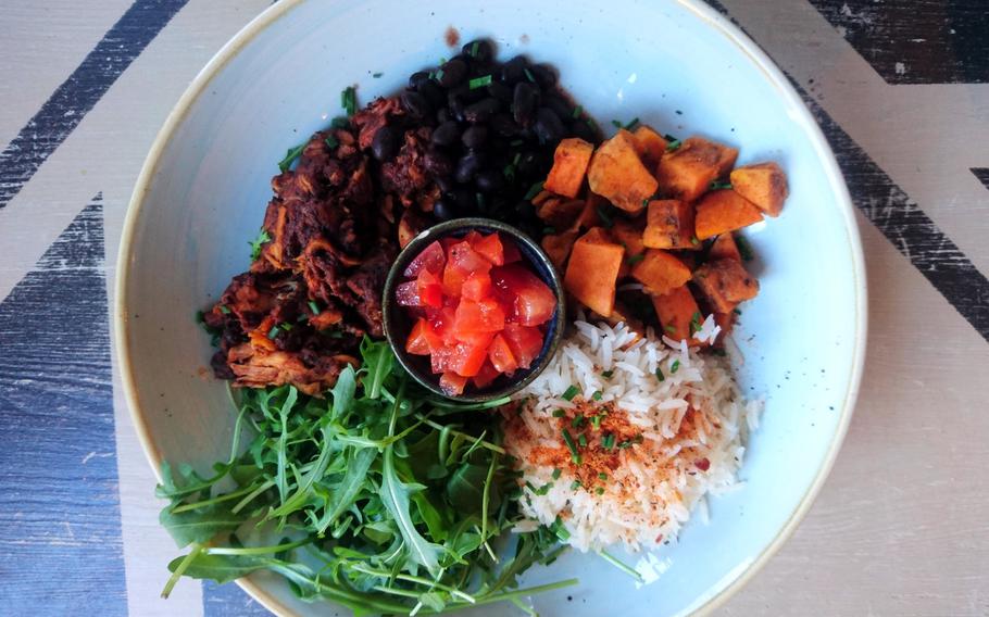 A nonvegetarian item on the menu of Edmundo Lounge is the Mexican Superbowl with Moroccan chicken, black beans, roasted sweet potato, butternut squash, balsamic rice, rocket, and tomato with chili salsa . The restaurant often tests new dishes on a specials menu.

