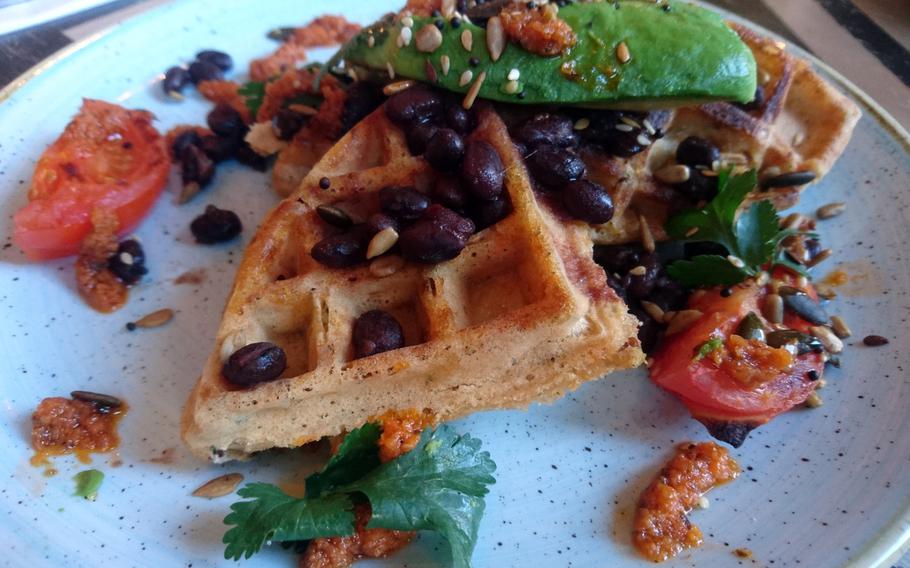 An order of sweet potato waffles with black beans, avocado, lime and coriander from the Edmundo Lounge, Bury St. Edmunds, England. The restaurant offers separate regular, gluten-free and vegan menus.

