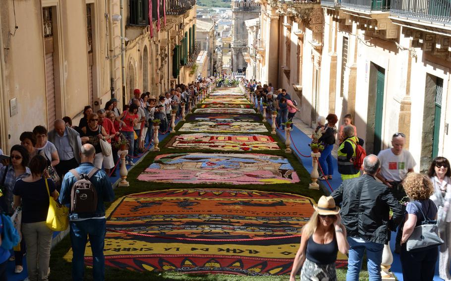 An infiorata is an event in which flowers petals are laid down in intricate patterns to create a temporary work of art. These are organized in Italy during the months of May and June, particularly around the religious holiday of Corpus Christi. This weekend's event in Noto is considered one of the best of its kind.