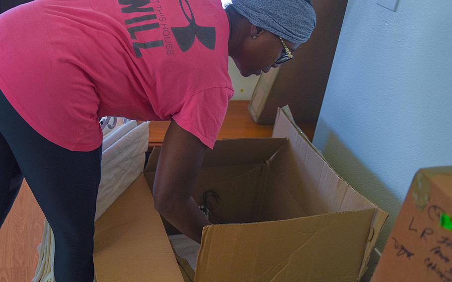 Tami Dugger unpacks boxes in her new home at Dyess Air Force Base, Texas on Aug. 29, 2018. 