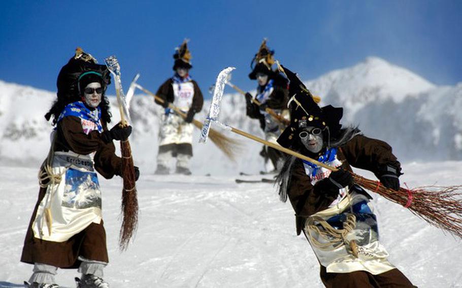 Downhill skiers dressed as witches race along an eight-mile stretch during the Witches Descent near Blatten Belalp, Switzerland. The event takes place Jan. 12-19 this year.