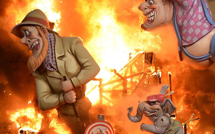 At Valencia's Fallas Bonfire Festival of San Jose, giant cardboard statues known as ninots are set aflame during the crema, a spectacle of light, music and fireworks. 