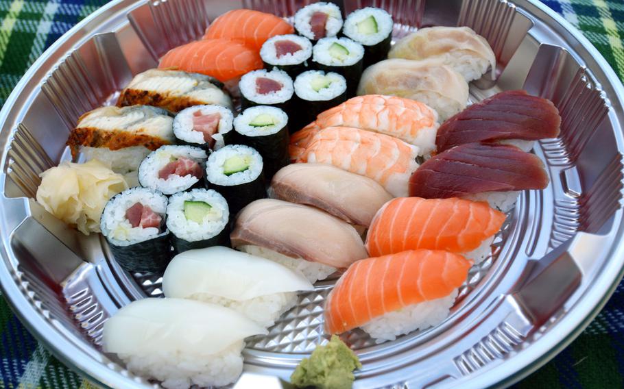 A double sushi combination takeout platter from Hashimoto in Saarbruecken, Germany, on Nov. 15, 2020. The offerings change based on availability. In this case, there was extra salmon and some higher-grade tuna in some of the rolls. 

