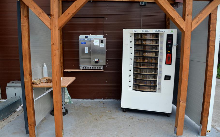 The vending machine at Bauernhof Kief in Hockenheim, Germany, with a fresh milk dispenser to the left, on Nov. 30, 2020. Vending machines aren't the most picturesque places to pick up food and drink, but they are open 24/7, every day of the year, including during the coronavirus pandemic, on German holidays and Sundays. 