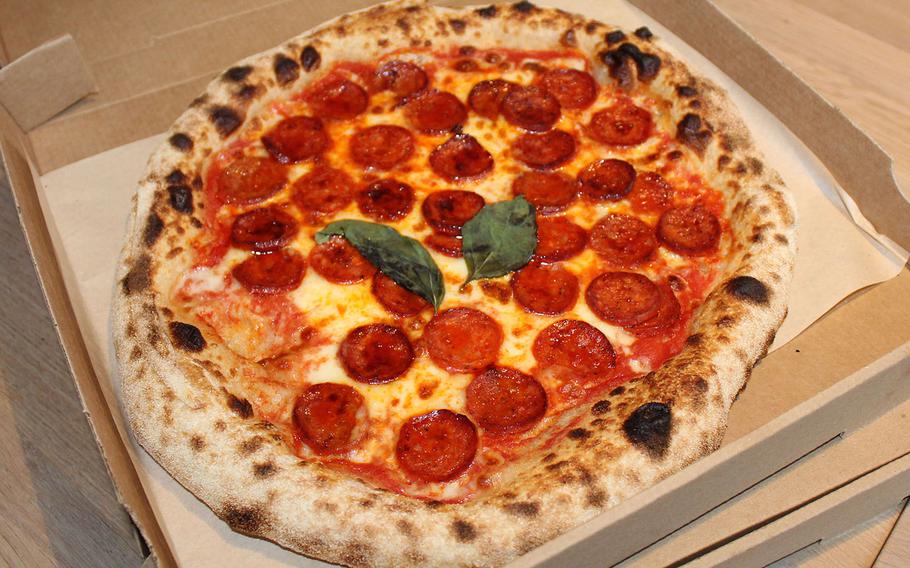 A pepperoni pizza from Lucy's Restaurant in Bury St. Edmunds. The base of the pizza is made from sourdough, and it is cooked in a bespoke Italian oven with a revolving base. 
