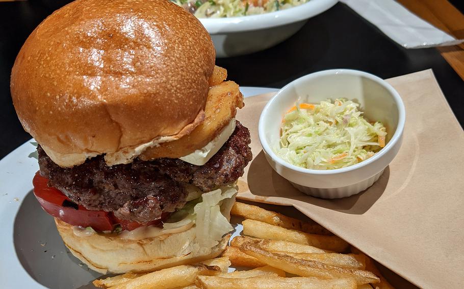 The baked apple burger from Under the Cascade in Tachikawa, Japan, comes with fries, coleslaw and a cup of onion soup. 
 

