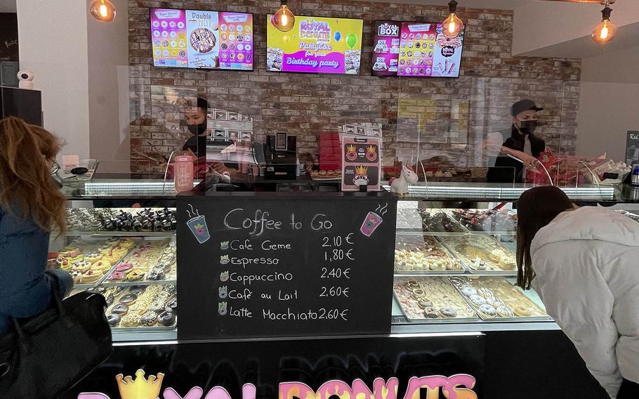 Customers inside Royal Donuts in Regensburg, Germany, face some tough decisions.