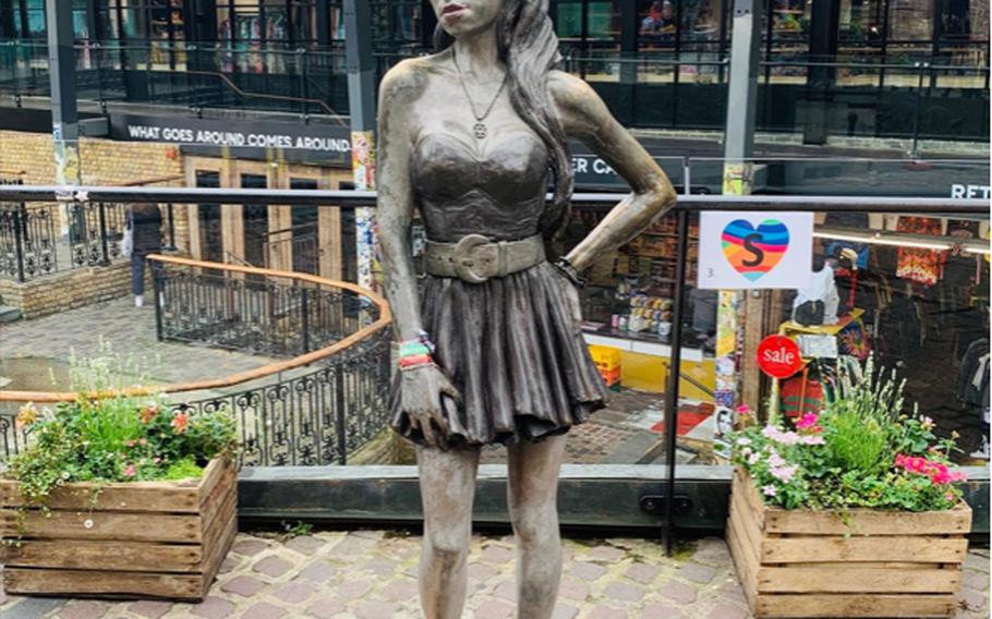 A life-sized statue of singer Amy Winehouse graces the Stables Market in London's Camden Town district.