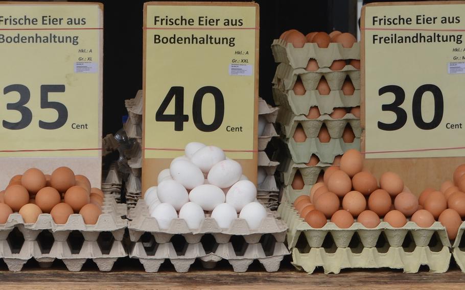 The egg stand in the outdoor market in Kaiserslautern, Germany, sells, from left to right, ''bodenhaltung'' eggs laid by chickens kept indoors, and ''freihaltung'' eggs from free-range chickens. ''Bio,'' or organic eggs, are also available. 