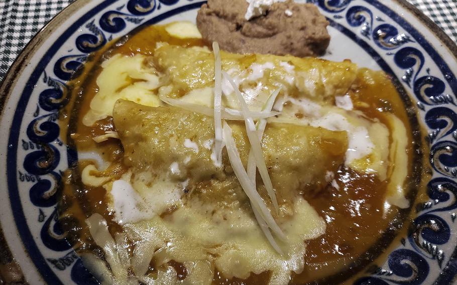 The chicken enchiladas from Posado del Sol, a Mexican eatery near Yokota Air Base, Japan, boast a delicious sauce with zing and the prefect amount of cheese.