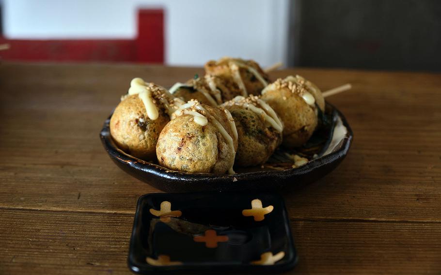 Takoyaki, or grilled octopus balls, are a popular street food in Japan made of deep-fried batter filled with chopped octopus. 

