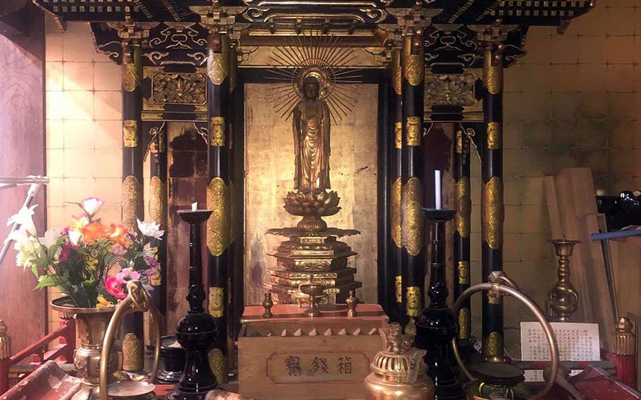 Hotaru, a 250-year-old temple that now serves as an inn in Urasa, Japan, is filled with altars and Buddhist artwork. 