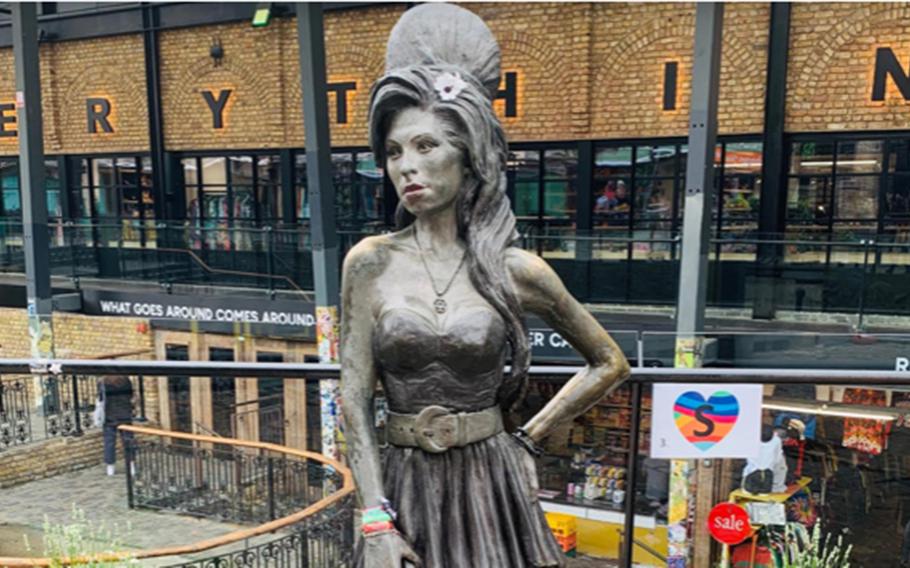 A life-sized statue of singer Amy Winehouse graces the Stables Market in London's Camden Town district.