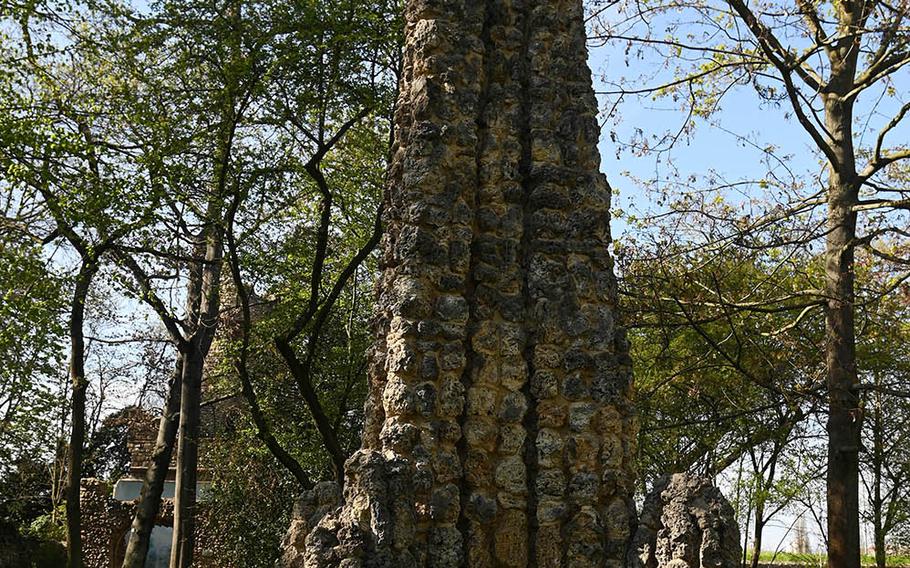 A child checks out the shell limestone-clad obelisk at Verna Park in Ruesslesheim, Germany. It is one of the oldest things in a park that was established in the mid-1800s.