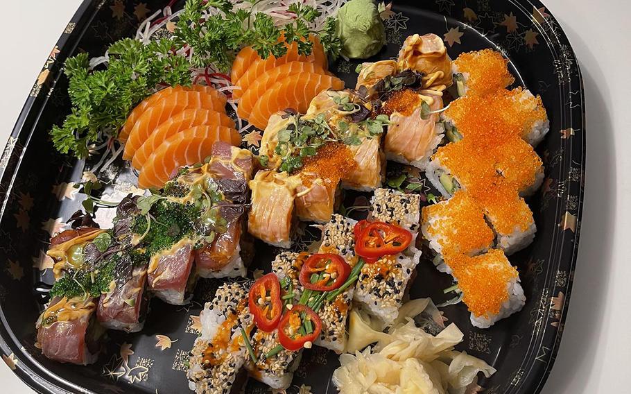 A variety of items from Kokoro including salmon sashimi, pirikara, California, momo and midori rolls.