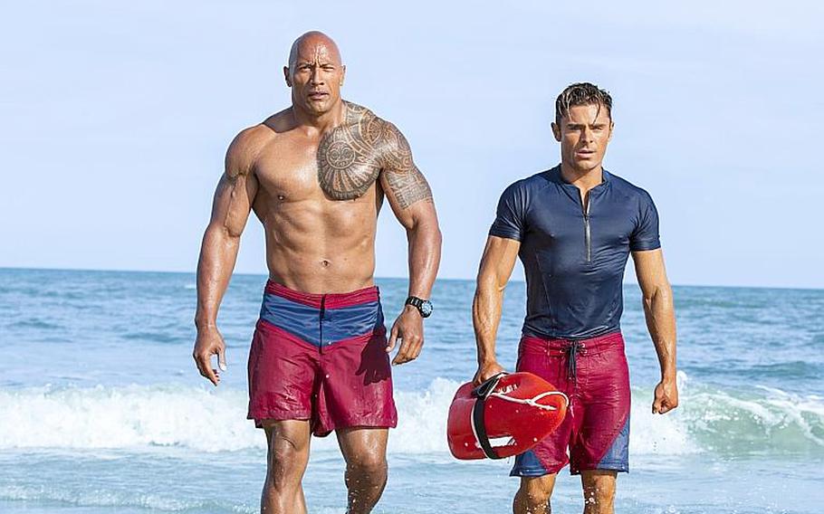This image released by Paramount Pictures shows Dwayne Johnson, Left, and Zac Efron in a scene from, "Baywatch," in theaters May 25. 